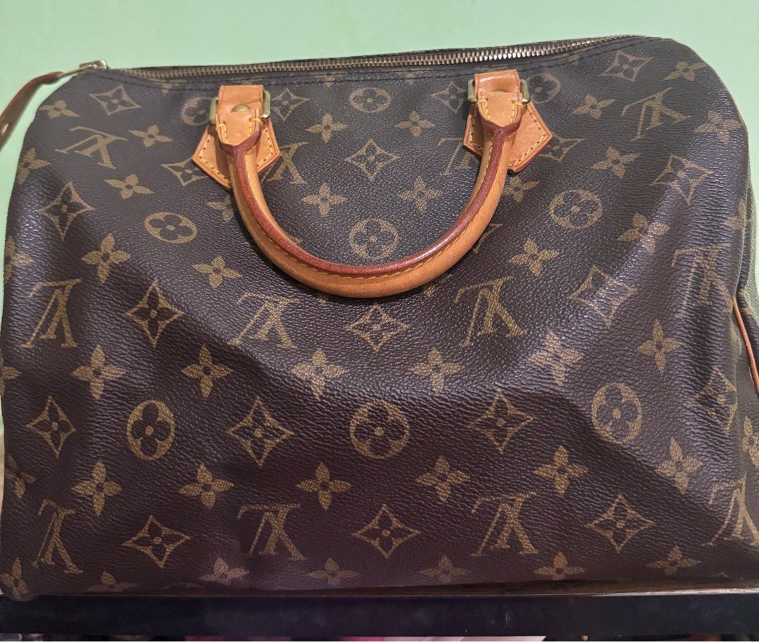 Louis Vuitton Speedy 30 Monogram Handbag (Category: Luxury Bags & Wallets) located in Quezon City. Submitted by mslen08 (Listing ID 1413539787, Image 2). Description: - Authentic Louis Vuitton Speedy 30 handbag - Classic Monogram canvas - Iconic LV pattern - Rolled leather handles - Top zipper closure - Spacious interior with pocket - Gold-toned hardware - Date code: SP0956 comes with original dustbag only RFS: closet space .