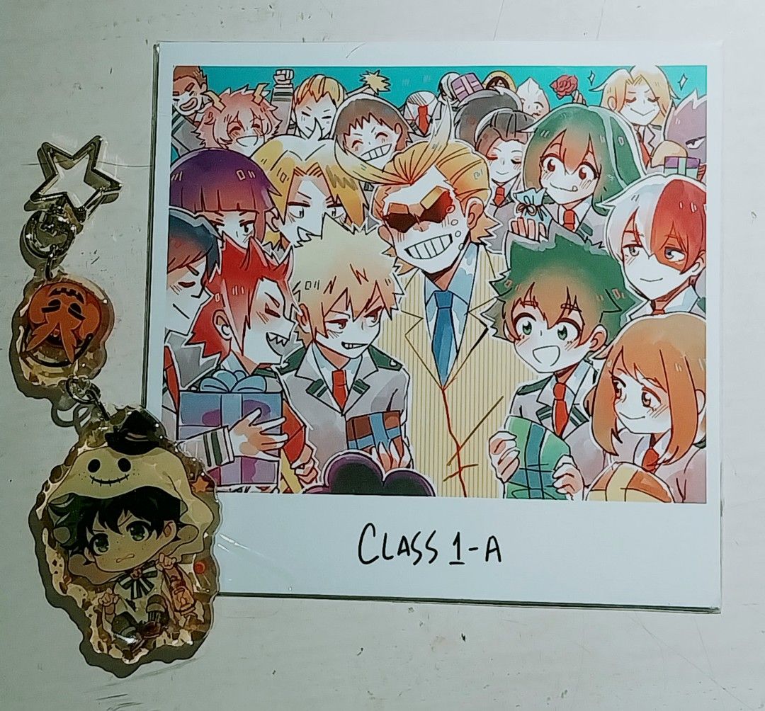 My Hero Academia Merch 2020 (Category: Character Goods) located in Makati City. Submitted by coldsundaez (Listing ID 1413542469, Image 1). Description: > Art print & keychain set! > From anime convention since 2020 > Print is still kept sealed in plastic > Halloween Deku resin keychain (it's a bit yellow now but still in good condition to use ><) > Received thru delivery (Lalamove, Grab). Shipping fee will be shouldered by buyer. > No returns/ref