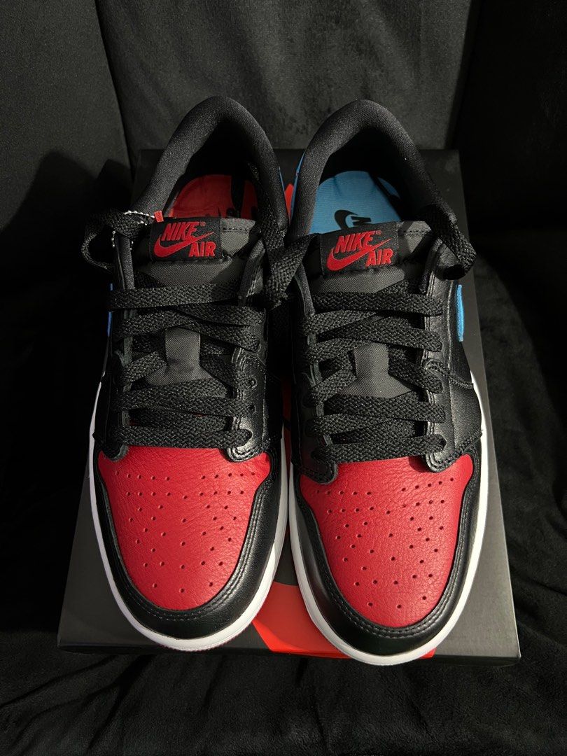 Nike Air Jordan 1 Retro Low OG (Category: Sneakers) located in Quezon City. Submitted by unfknblvblgrl (Listing ID 1413648400, Image 2). Description: - Nike Air Jordan 1 Retro Low OG - Size: US 9.5 - Colorway: Black, red, and light blue - Features a red toe box - Comes with original box and extra laces - Nike Air logo on tongue and insole.