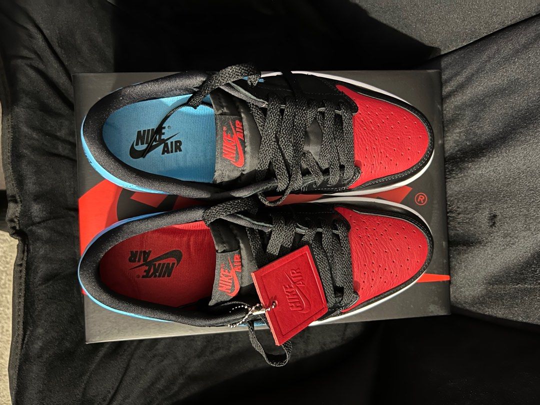 Nike Air Jordan 1 Retro Low OG (Category: Sneakers) located in Quezon City. Submitted by unfknblvblgrl (Listing ID 1413648400, Image 1). Description: - Nike Air Jordan 1 Retro Low OG - Size: US 9.5 - Colorway: Black, red, and light blue - Features a red toe box - Comes with original box and extra laces - Nike Air logo on tongue and insole.