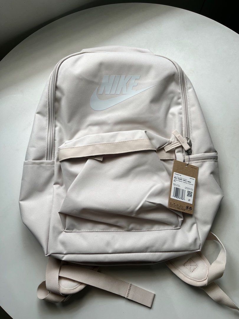 Nike Heritage Backpack (25L) - Light Orewood Brown (Category: Backpacks) located in Quezon City. Submitted by ammp15 (Listing ID 1413643518, Image 2). Description: - Nike Heritage Backpack - Spacious main compartment - Front pocket for easy access - Padded back panel for comfort - Adjustable shoulder straps - Top handle for carrying - Secure zipper closure - Nike logo prominently displayed.