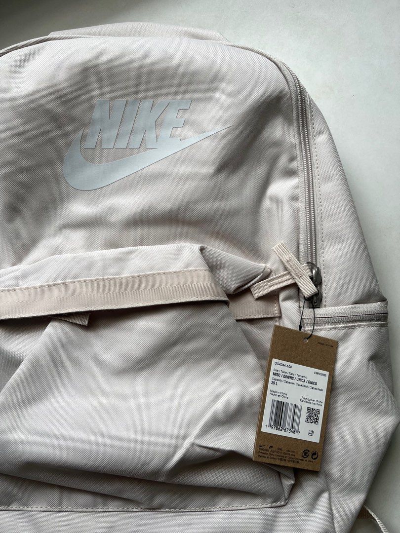 Nike Heritage Backpack (25L) - Light Orewood Brown (Category: Backpacks) located in Quezon City. Submitted by ammp15 (Listing ID 1413643518, Image 3). Description: - Nike Heritage Backpack - Spacious main compartment - Front pocket for easy access - Padded back panel for comfort - Adjustable shoulder straps - Top handle for carrying - Secure zipper closure - Nike logo prominently displayed.