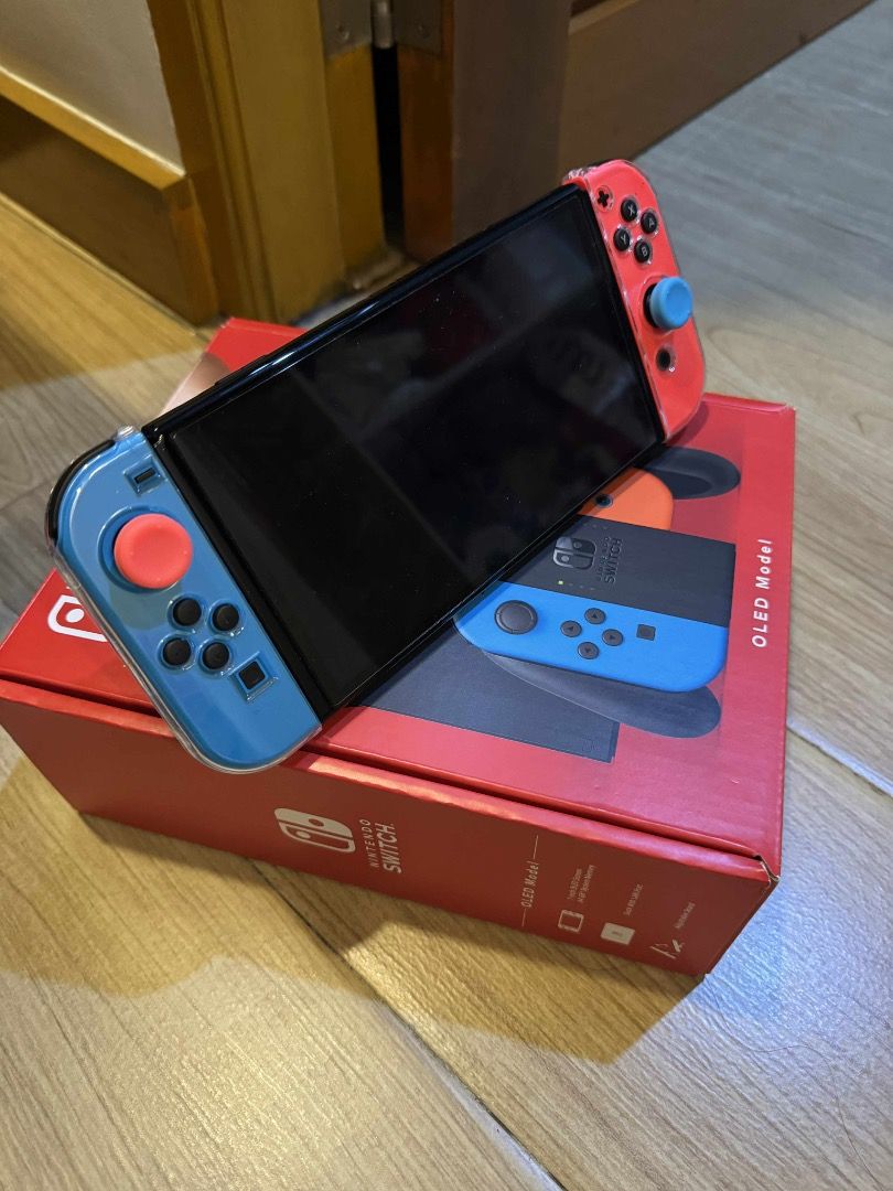 Nintendo Switch OLED Model (Category: Nintendo) located in Manila. Submitted by declutterbyj_ (Listing ID 1413521861, Image 2). Description: - Nintendo Switch OLED Model - Red and blue Joy-Cons included - Comes with original box - OLED model - Ilang times lang nagamit - Good condition.