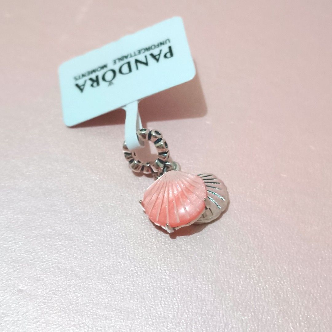 Pandora Coral-colored Shell Double Dangle Charm (Category: Charms) located in Santa Rosa. Submitted by love.jewels (Listing ID 1413619131, Image 1). Description: ALL ITEMS ARE NEGOTIABLE, YOU ARE FREE TO MAKE AN OFFER, I. WILL GIVE YOU THE BEST PRICE 😍 ALL BRANDNEW NOT PRELOVED NOT SECOND-HAND FROM FACTORY FOR BRACELET 16-21 CM AVAILABLE SIZES FOR RING 5-10 AVAILABLE SIZE.