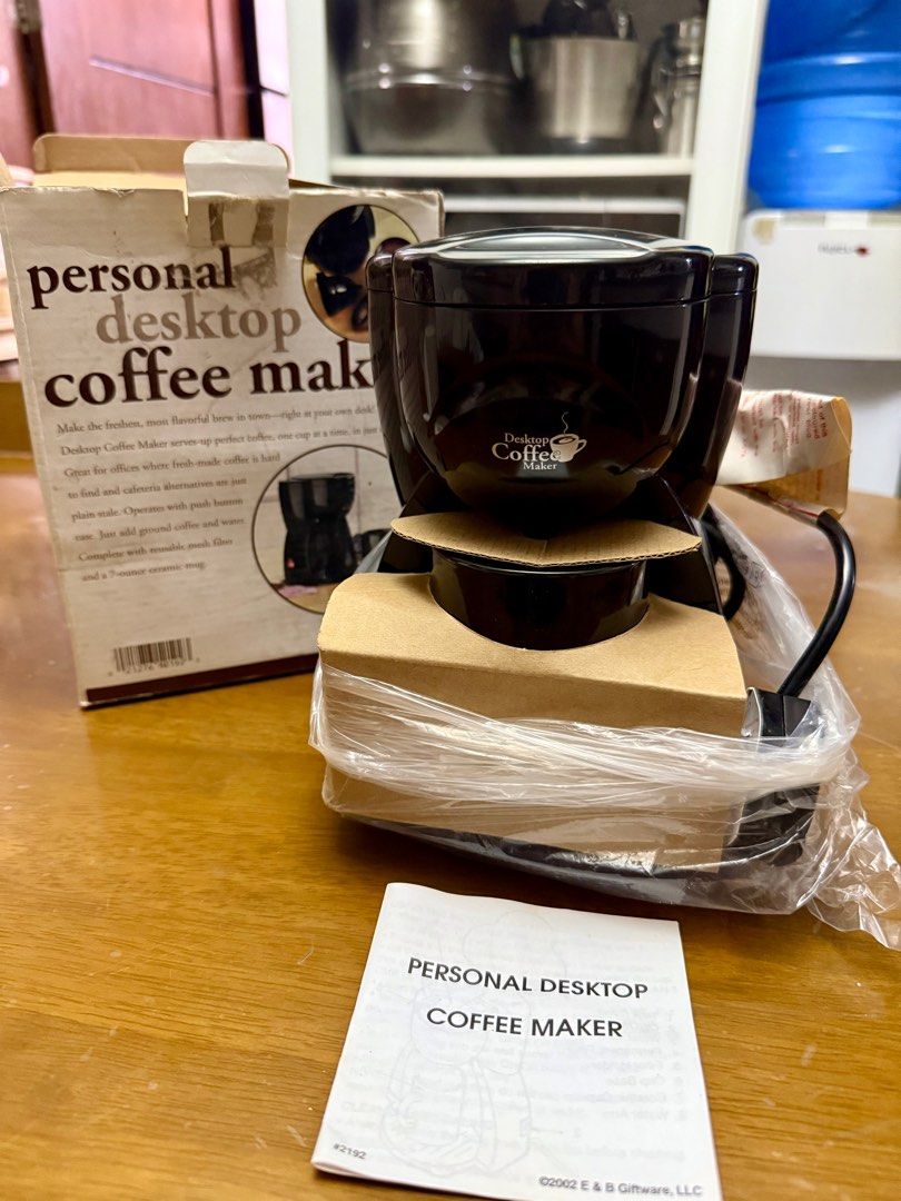 Personal Desktop Coffee Maker (Category: Coffee Machines & Makers) located in Pilar. Submitted by faveanyshop (Listing ID 1413486323, Image 2). Description: - Personal desktop coffee maker - Includes reusable mesh filter - Comes with a 7-ounce ceramic mug - Simple to use: add coffee and water - Brews fresh, flavorful coffee, one cup at a time.