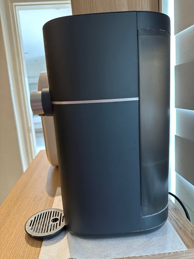 Philips Instant Water Dispenser (Category: Water Purifiers & Dispensers) located in Valenzuela. Submitted by jaylight (Listing ID 1413580364, Image 2). Description: RFS: Decluttering Philips instant water dispenser offers various temperature settings: 95°C, 85°C, 45°C, and ambient. It also has options for 500ml, 200ml, and 100ml dispensing, along with a customize feature. Features a safety lock for added security. The dispenser is dark gray in co
