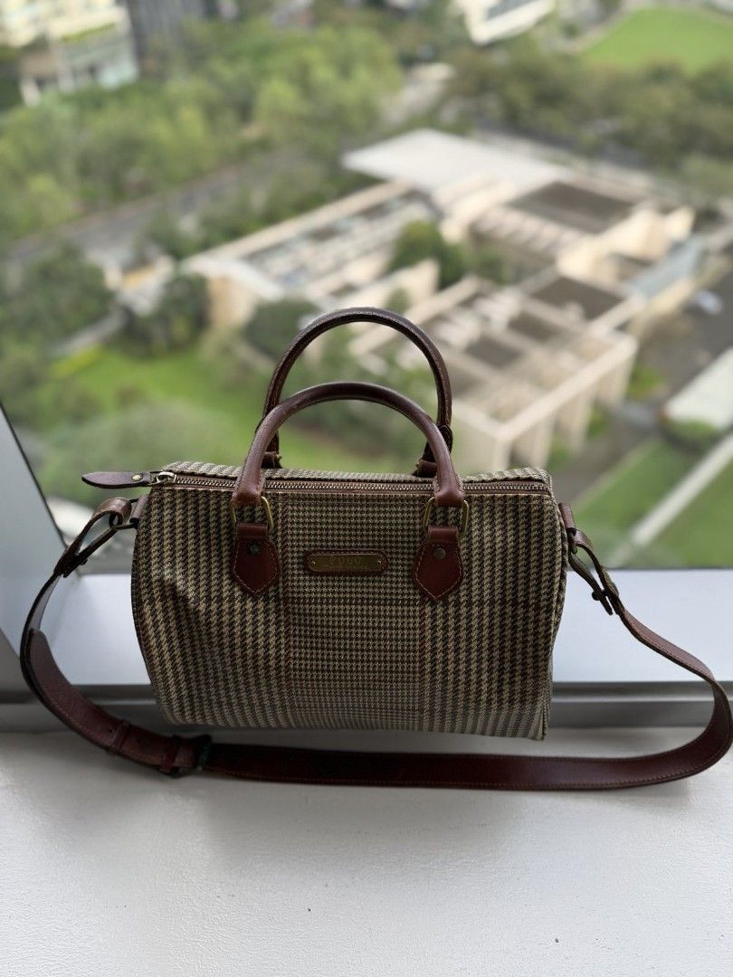 Polo Ralph Lauren Handbag (Category: Luxury Bags & Wallets) located in Taguig. Submitted by simplyjtreasures (Listing ID 1413549731, Image 1). Description: - Polo Ralph Lauren handbag - Brown and beige houndstooth pattern - Top handle and detachable shoulder strap - Brown leather accents - Small rectangular plaque detail - Classic, compact design - Perfect for everyday use - bought fr Hk store.