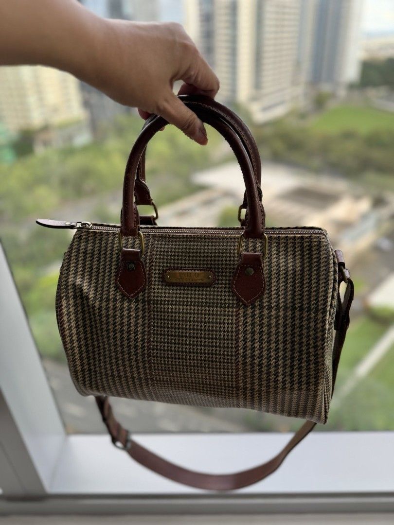 Polo Ralph Lauren Handbag (Category: Luxury Bags & Wallets) located in Taguig. Submitted by simplyjtreasures (Listing ID 1413549731, Image 2). Description: - Polo Ralph Lauren handbag - Brown and beige houndstooth pattern - Top handle and detachable shoulder strap - Brown leather accents - Small rectangular plaque detail - Classic, compact design - Perfect for everyday use - bought fr Hk store.