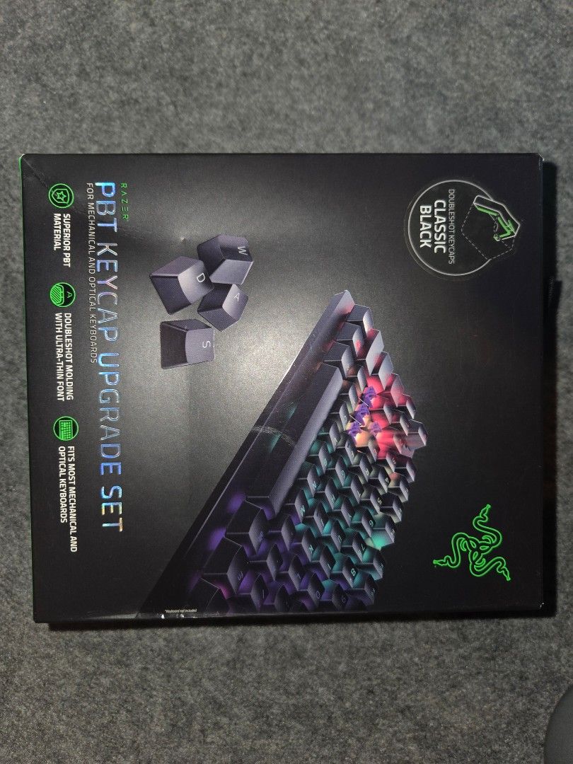 Razer PBT Keycap Upgrade Set - Classic Black (Category: Computer Keyboard) located in Quezon City. Submitted by gutterflower (Listing ID 1413486445, Image 1). Description: - Razer PBT Keycap Set for mechanical/optical keyboards - Durable double-shot PBT keycaps - Ultra-thin fonts - Classic black color - Includes keycaps and stabilizers - Compatible with most mechanical and optical keyboards.