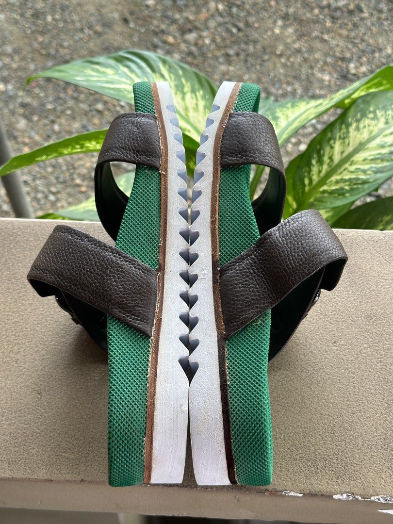 Salvatore Ferragamo Leather Slip on (Category: Slippers & Slides) located in Munoz. Submitted by iam_j (Listing ID 1413450681, Image 2). Description: - Authentic Salvatore Ferragamo Slip On - Brown leather strap with buckle closure - Green footbed with Ferragamo logo - White sole with Ferragamo logo and "Extra Light" text - Made in Italy - Size 8mens (40/26 cm).