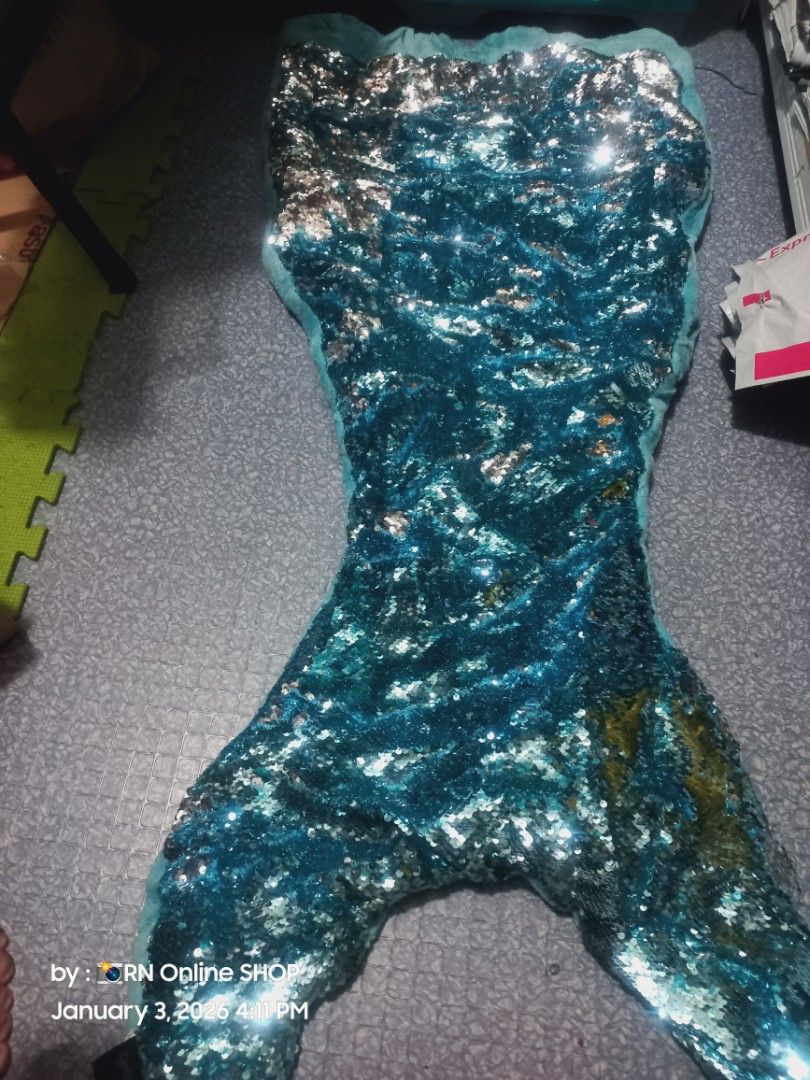 Sequin Mermaid Tail (Category: Babies & Kids Fashion) located in Caloocan City. Submitted by rb_17 (Listing ID 1413437522, Image 2). Description: - Beautiful sequin mermaid tail - Length: 41-50 inches - Width: 21 inches - Eye-catching blue and silver color - Ideal for costumes and imaginative play.