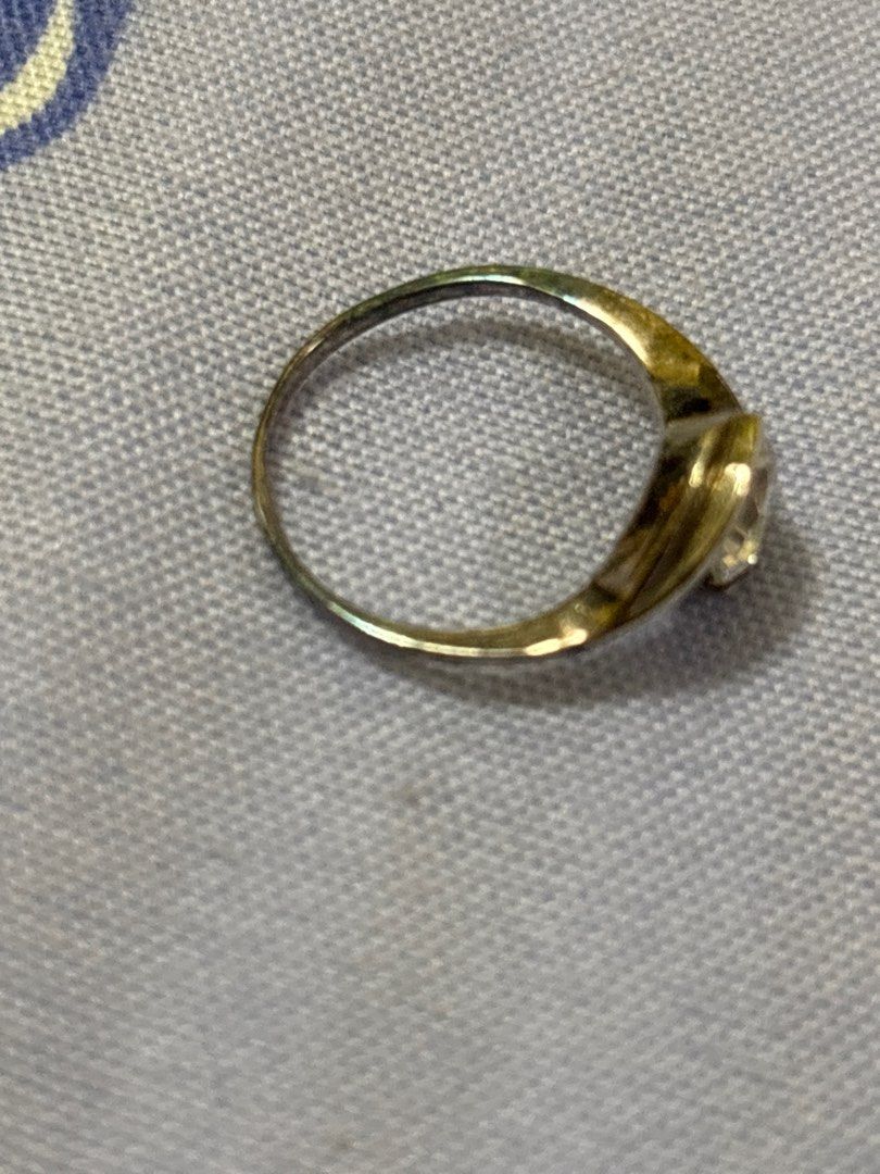 Silver Ring with Clear Stone (Category: Rings) located in Quezon City. Submitted by luxgoals (Listing ID 1413517830, Image 3). Description: - Silver ring with a clear, round-cut stone - Unique swirling band design - Comes with a clear, faceted box - Red velvet interior - Classic and elegant - Ideal gift or addition to a jewelry collection.