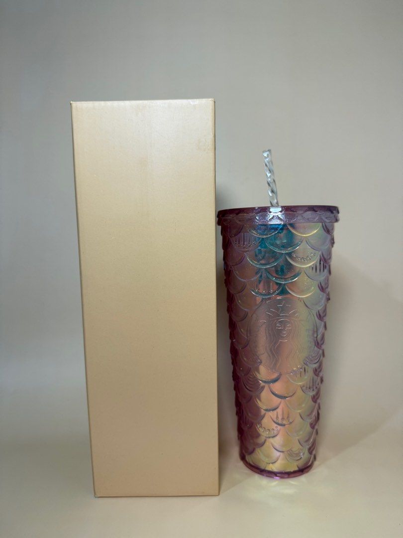 Iridescent Mermaid Tumbler (Category: Water Bottles & Tumblers) located in Pasig City. Submitted by chikaching (Listing ID 1413436877, Image 1). Description: - Tumbler with iridescent mermaid scale design - Includes matching straw - Comes with original box - Features the Starbucks logo - Standard size for cold beverages.