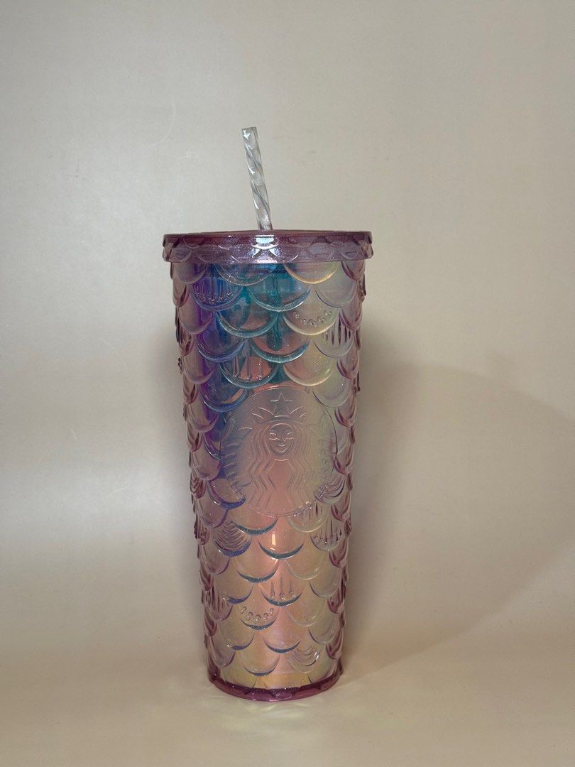 Iridescent Mermaid Tumbler (Category: Water Bottles & Tumblers) located in Pasig City. Submitted by chikaching (Listing ID 1413436877, Image 2). Description: - Tumbler with iridescent mermaid scale design - Includes matching straw - Comes with original box - Features the Starbucks logo - Standard size for cold beverages.