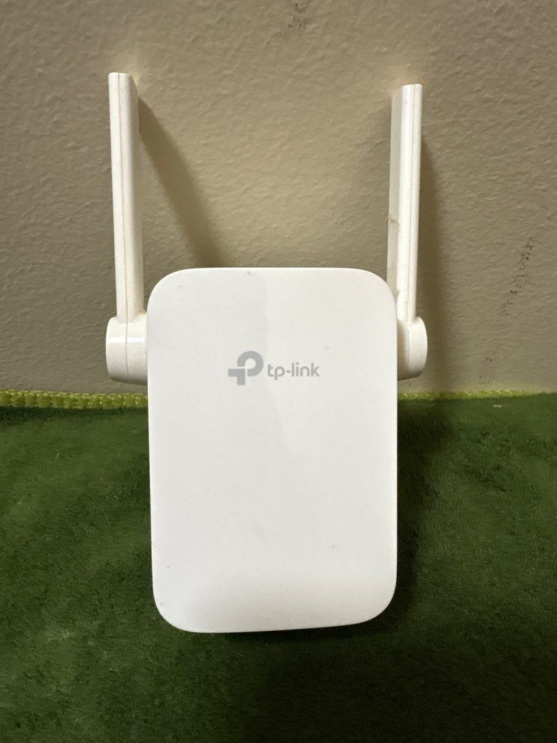 TP-Link TL-WA855RE 300Mbps WiFi Range Extender (Category: Networking) located in Quezon City. Submitted by athenskid (Listing ID 1413518297, Image 2). Description: TP-Link TL-WA855RE WiFi range extender. It has two external antennas and a built-in power plug. The device supports 100-240V and 50/60Hz. It is a 300Mbps WiFi range extender. The model number is TL-WA855RE. The device is white in color..