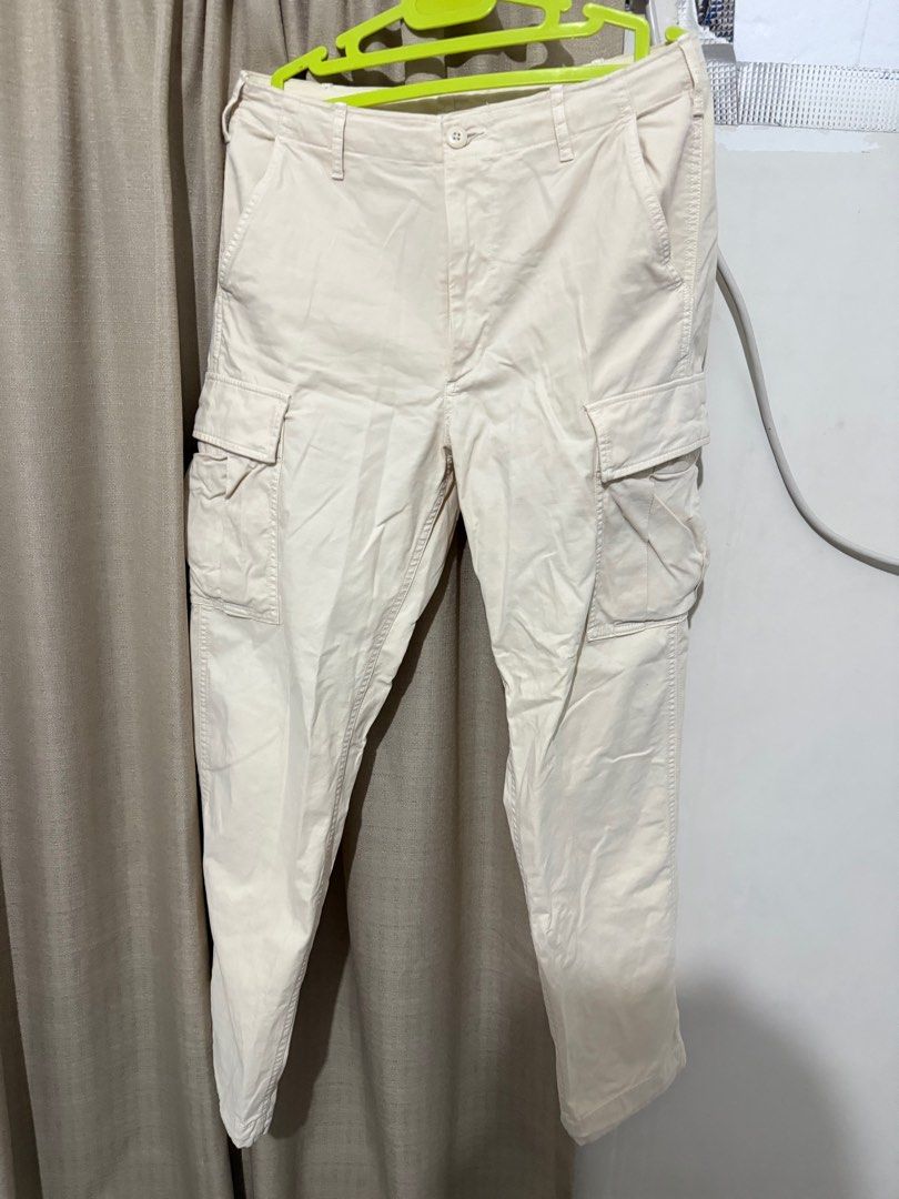 Uniqlo Cargo Pants - Size S (Category: Other Bottoms) located in Cabanatuan. Submitted by declutterpg (Listing ID 1413621932, Image 1). Description: - Uniqlo Cargo Pants - Color: Cream - Size: S (Waist: 68-76cm) - Features: - Multiple pockets - Adjustable cuffs - Material: - 98% Cotton, 2% Spandex - Pocket lining/trim: 100% Cotton - Made in Indonesia.