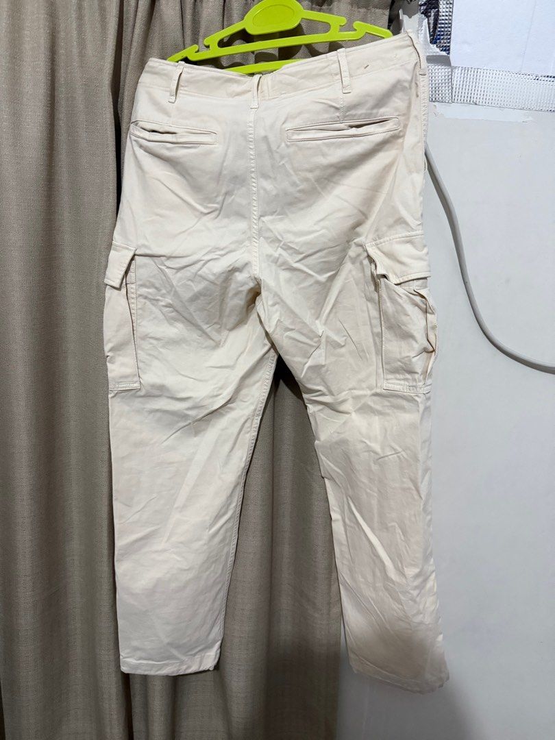 Uniqlo Cargo Pants - Size S (Category: Other Bottoms) located in Cabanatuan. Submitted by declutterpg (Listing ID 1413621932, Image 2). Description: - Uniqlo Cargo Pants - Color: Cream - Size: S (Waist: 68-76cm) - Features: - Multiple pockets - Adjustable cuffs - Material: - 98% Cotton, 2% Spandex - Pocket lining/trim: 100% Cotton - Made in Indonesia.