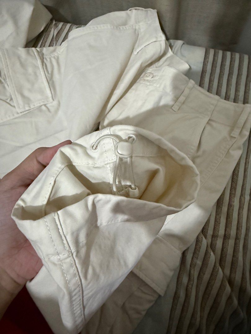 Uniqlo Cargo Pants - Size S (Category: Other Bottoms) located in Cabanatuan. Submitted by declutterpg (Listing ID 1413621932, Image 3). Description: - Uniqlo Cargo Pants - Color: Cream - Size: S (Waist: 68-76cm) - Features: - Multiple pockets - Adjustable cuffs - Material: - 98% Cotton, 2% Spandex - Pocket lining/trim: 100% Cotton - Made in Indonesia.