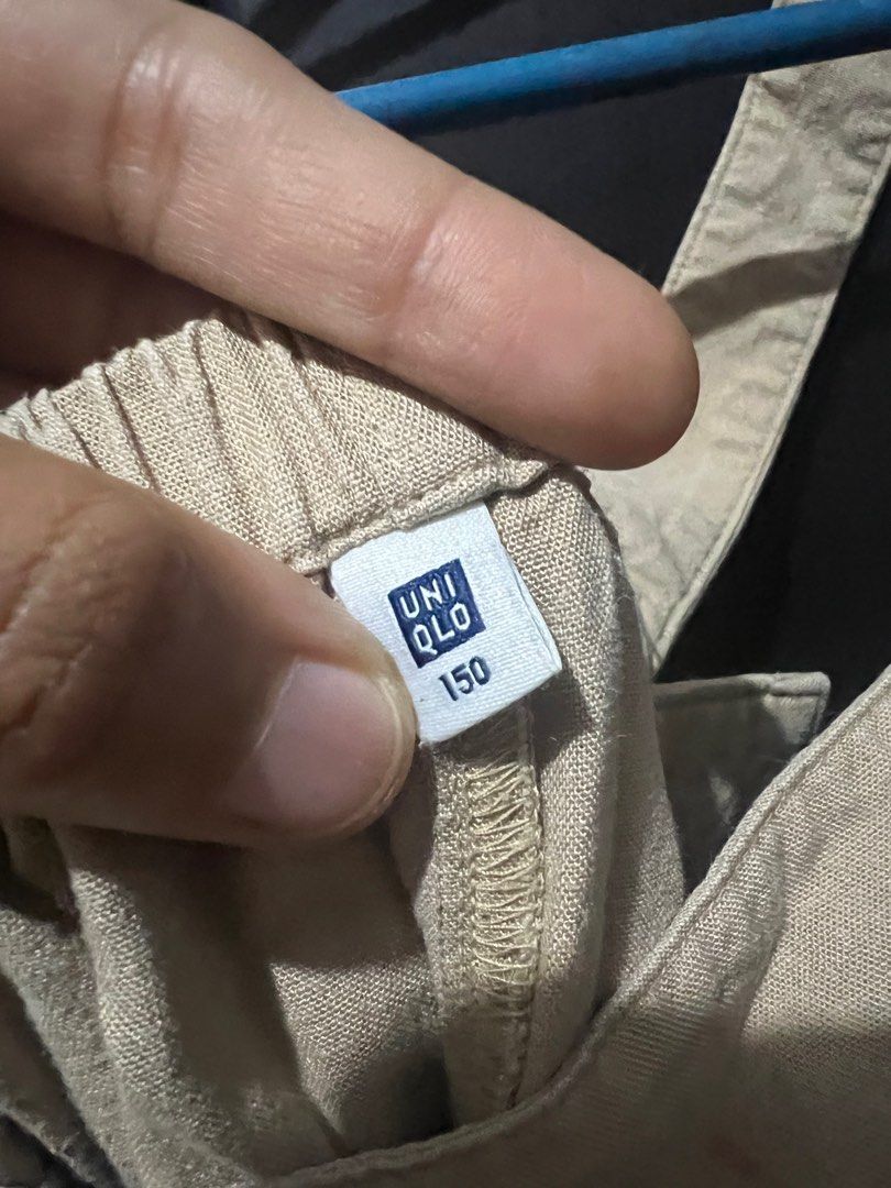 Uniqlo Jumpsuit - Size 150 (Category: Babies & Kids Fashion) located in San Mateo. Submitted by junked (Listing ID 1413617483, Image 2). Description: - Uniqlo beige jumpsuit - Size: 150 - Features: - Square neckline - Wide legs - Adjustable straps - Side pockets - Made of lightweight fabric - Ideal for casual wear.