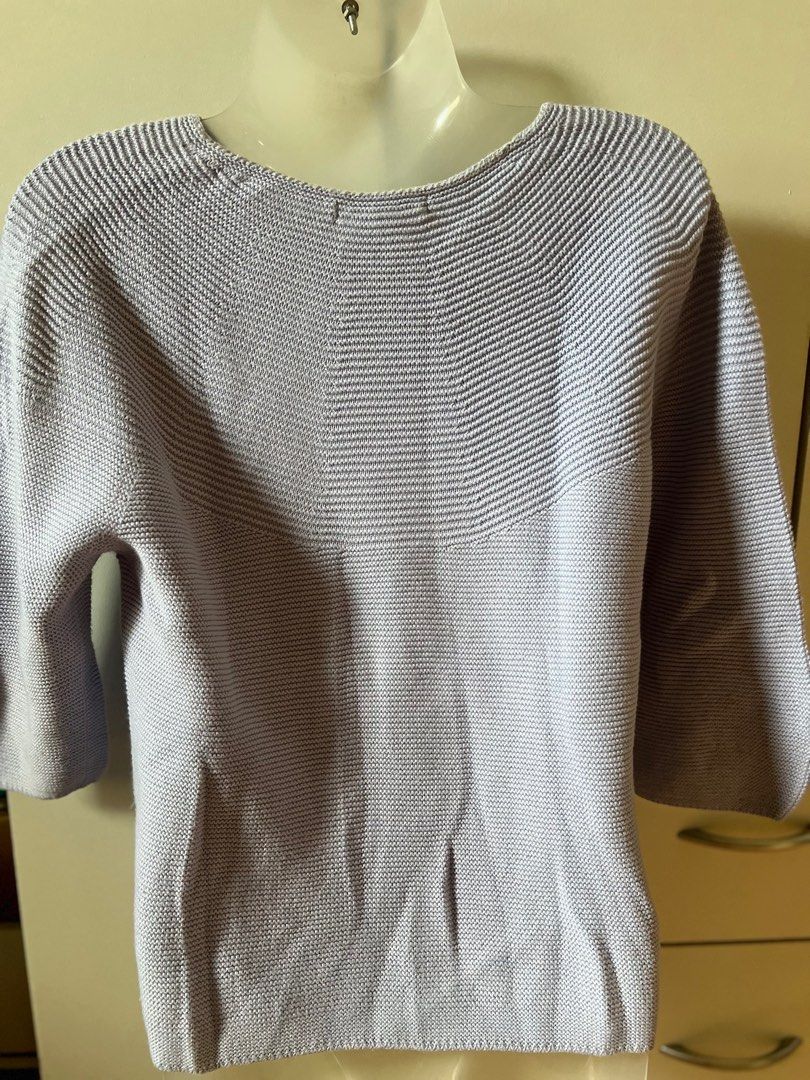 Uniqlo Lavender Knit Sweater (Category: Longsleeves) located in Bulacan. Submitted by monaami (Listing ID 1413437965, Image 2). Description: - Uniqlo Lavender Sweater - Size: S - Features: Boat neck, 3/4 sleeves, ribbed knit - Made in Vietnam - Versatile style.