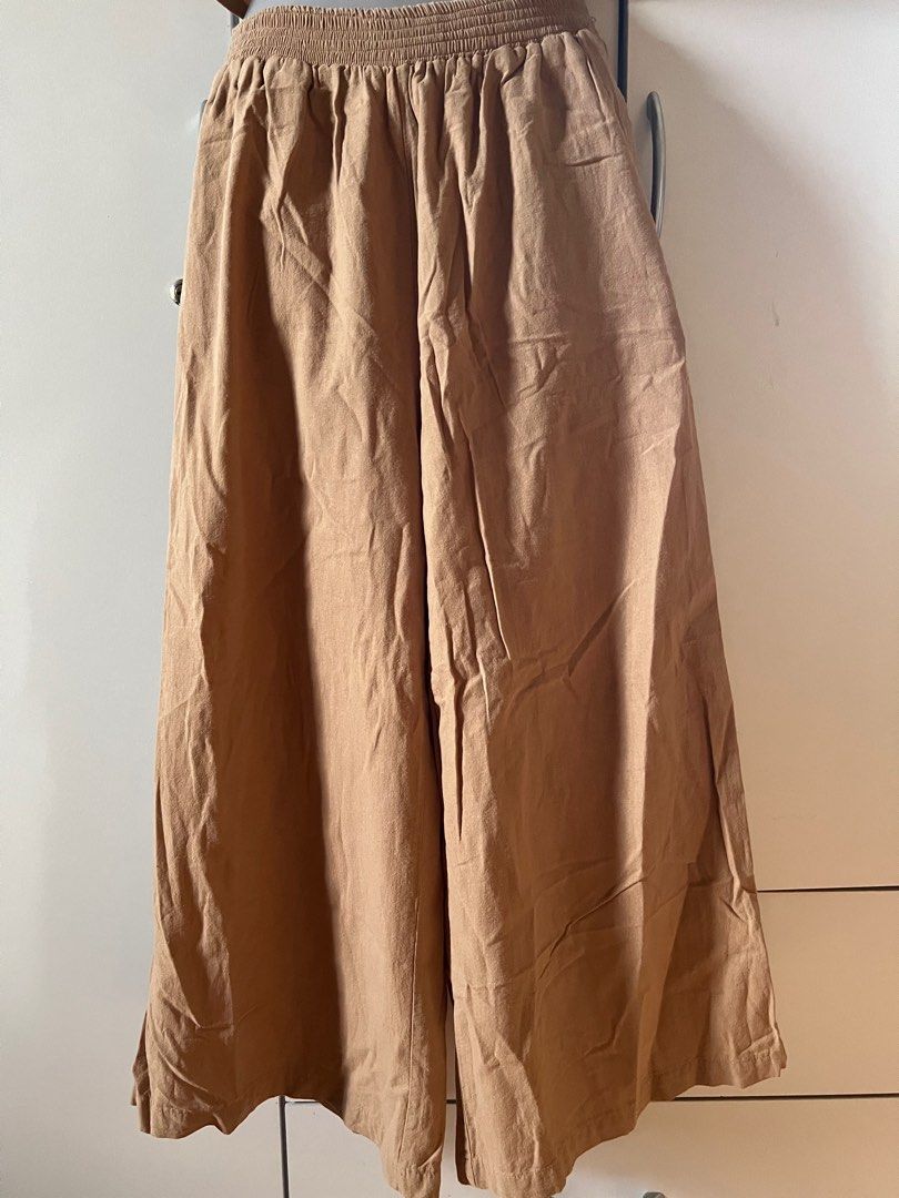 Sets/Coords - Wanhiyan (Category: Sets or Coordinates) located in Bulacan. Submitted by monaami (Listing ID 1413447293, Image 3). Description: Top: Length 40cm Bust 100cm Pants: Length 88cm Waist 70cm (stretchable up to 90cm) Reversible top!!! - Wanhiyan chestnut-colored set - Includes a crop top and wide-leg pants - Crop top features a V-neck and slightly flared design - Pants have an elastic waistband - Made of lightweight fabric - Ideal for wa