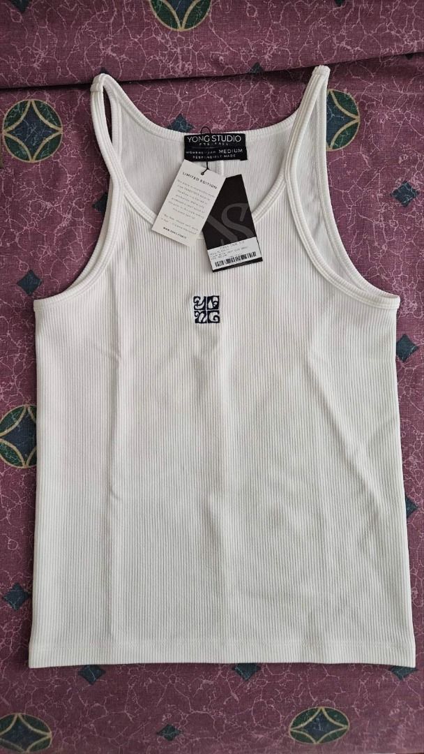Yong Studio - Tonia Tank Top (Category: Sleeveless) located in Pasig City. Submitted by samjavxx (Listing ID 1413634911, Image 1). Description: Brand new, never worn, but no tag Bought for SRP P2899 White tank top with blue embroidery (not on website but bought in the Podium store) part of their Pre-Fall '25 collection RFS: bought another in preferred color :).