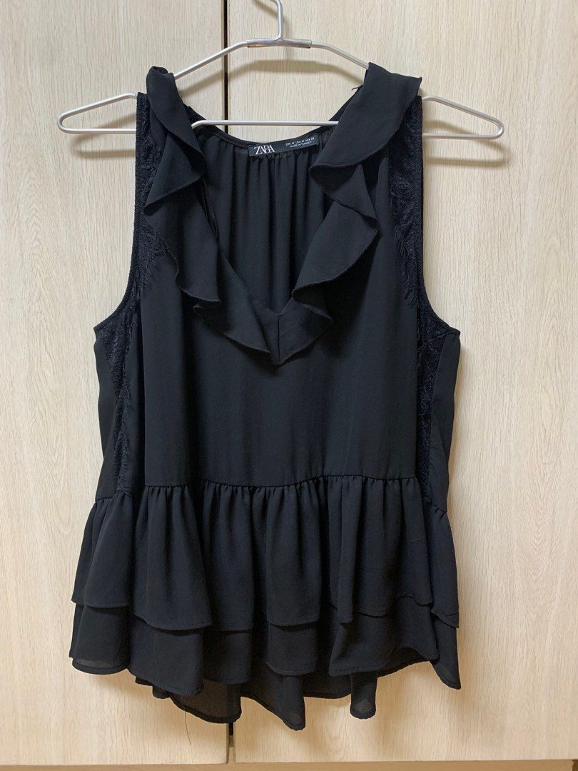 Zara Black Ruffle Sleeveless Party Top (Category: Sleeveless) located in San Juan City. Submitted by andyria (Listing ID 1413601879, Image 1). Description: - Zara black top - Sleeveless - Ruffle detailing - Lace accents - V-neck - Layered ruffle hem - Size M - Made in Turkey.