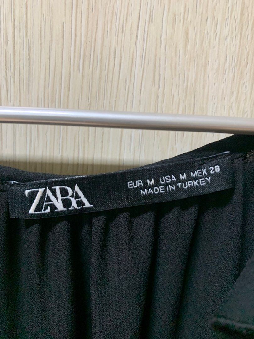 Zara Black Ruffle Sleeveless Party Top (Category: Sleeveless) located in San Juan City. Submitted by andyria (Listing ID 1413601879, Image 2). Description: - Zara black top - Sleeveless - Ruffle detailing - Lace accents - V-neck - Layered ruffle hem - Size M - Made in Turkey.