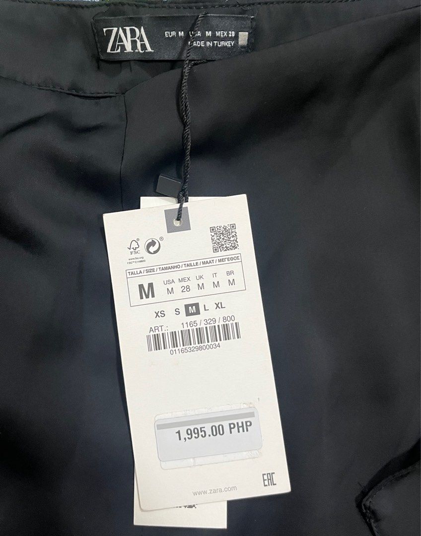 Zara Black Satin Wrap Skirt (Category: Skirts) located in Muntinlupa City. Submitted by a.decluttering (Listing ID 1413616340, Image 3). Description: - Zara black satin wrap skirt - Size: M - Brand new, still with tag - Original price: ₱1,995.