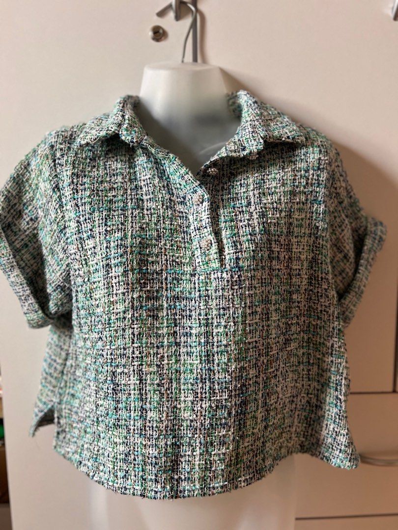 Zara Tweed Top XS (Category: Blouses) located in Bulacan. Submitted by monaami (Listing ID 1413439627, Image 1). Description: - Zara tweed top - Size: XS - Features: Collared neckline, short sleeves, button-down closure - Fit: Cropped - Fabric: Textured tweed with green, blue, and white shades - Made in China.