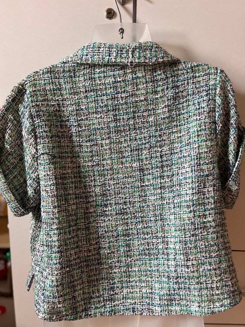 Zara Tweed Top XS (Category: Blouses) located in Bulacan. Submitted by monaami (Listing ID 1413439627, Image 2). Description: - Zara tweed top - Size: XS - Features: Collared neckline, short sleeves, button-down closure - Fit: Cropped - Fabric: Textured tweed with green, blue, and white shades - Made in China.