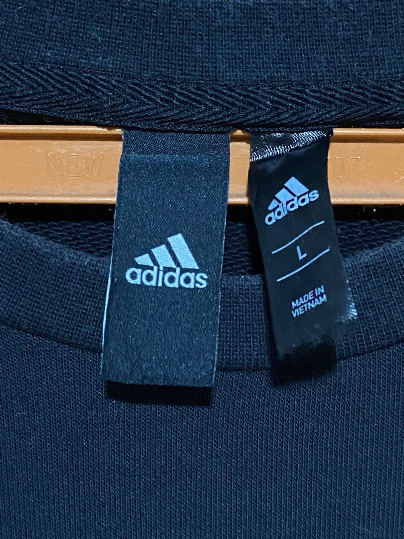 Adidas Black Sweatshirt - Size L (Category: Coats, Jackets and Outerwear) located in Santa Rosa. Submitted by dklutter25 (Listing ID 1413833754, Image 2). Description: - Adidas sweatshirt - Size: L - White Adidas logo on front - Made in Vietnam - Material: 70% cotton, 30% polyester - Condition: Some stains present - Care label included -Issue: Paint Stains.