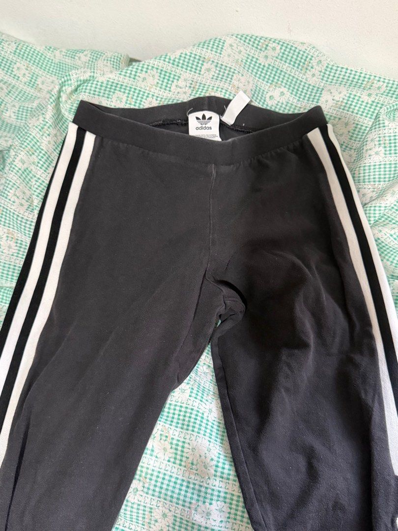 Adidas Trefoil Leggings (Category: Activewear) located in Malabon City. Submitted by decluttergyal (Listing ID 1412126452, Image 2). Description: - Adidas leggings - Black with white stripes - Adidas logo detail - Stretchy material - Classic three-stripe design - Mid-waist - Lightly used but no flaws or issues at all, it’s just that I’ve used it multiple times..