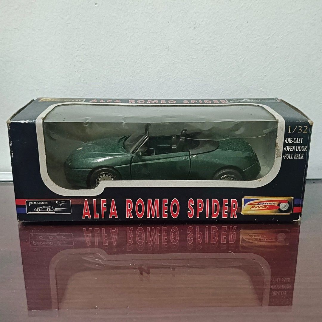 Alfa Romeo Spider 1/32 Diecast Model (Category: Vehicle & Diecast Models) located in Quezon City. Submitted by irobertpo82934 (Listing ID 1413826428, Image 1). Description: - 1/32 scale diecast model - Features opening doors and reclining seats - Unique dark emerald green color - Comes in original box (some wear and tear).
