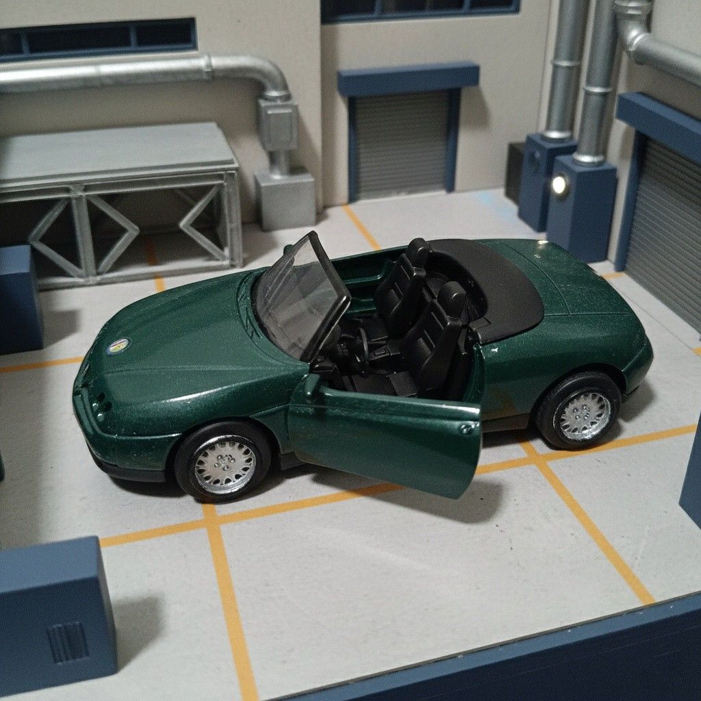Alfa Romeo Spider 1/32 Diecast Model (Category: Vehicle & Diecast Models) located in Quezon City. Submitted by irobertpo82934 (Listing ID 1413826428, Image 2). Description: - 1/32 scale diecast model - Features opening doors and reclining seats - Unique dark emerald green color - Comes in original box (some wear and tear).