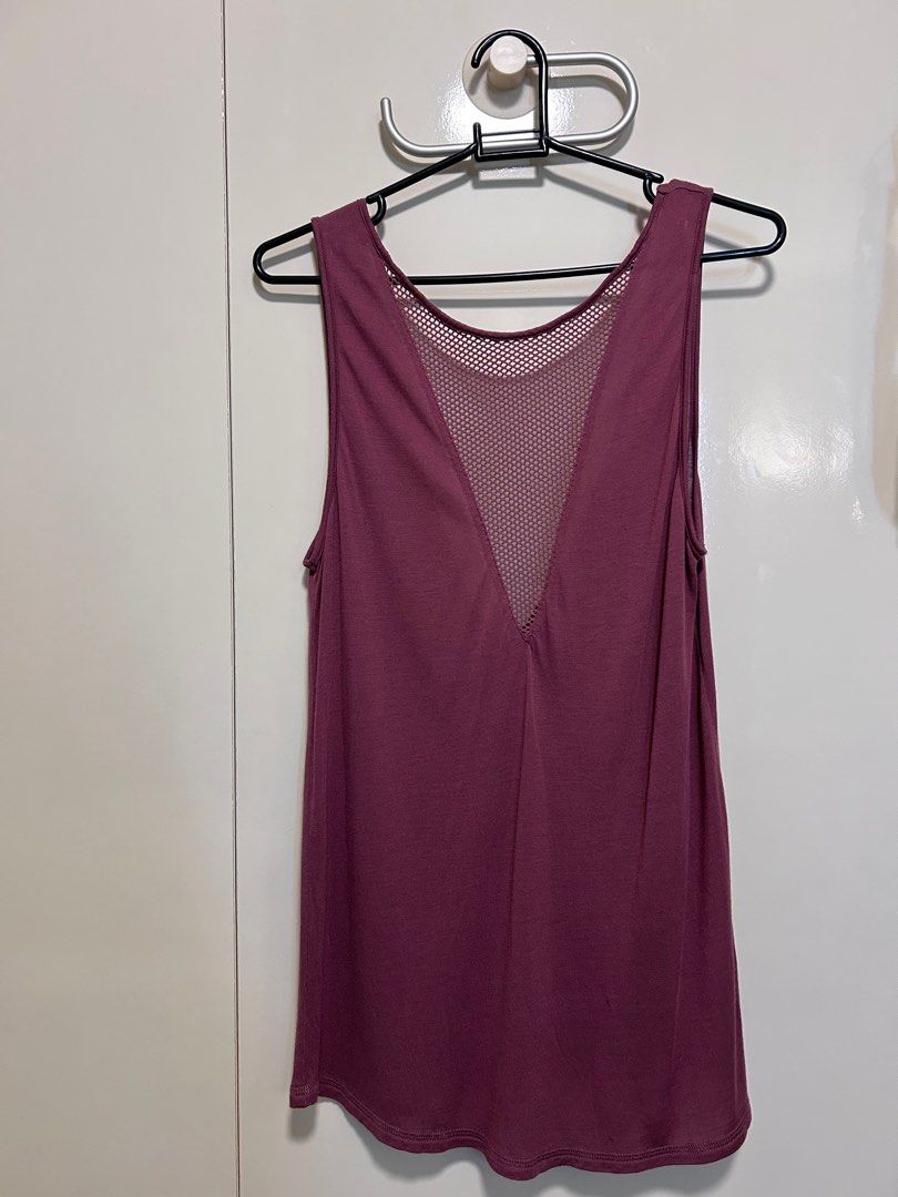Alo Yoga Mesh Back Tank Top (Category: Activewear) located in Singapore. Submitted by magnolia1937 (Listing ID 1413752001, Image 1). Description: - Alo Yoga tank top - Stylish mesh front design, deep v bare back - Dusky purple color - Soft, buttery material - Minimal signs of wear - Perfect for yoga, workouts, and casual wear Hardly used. Letting go at a steep discount from purchase price.