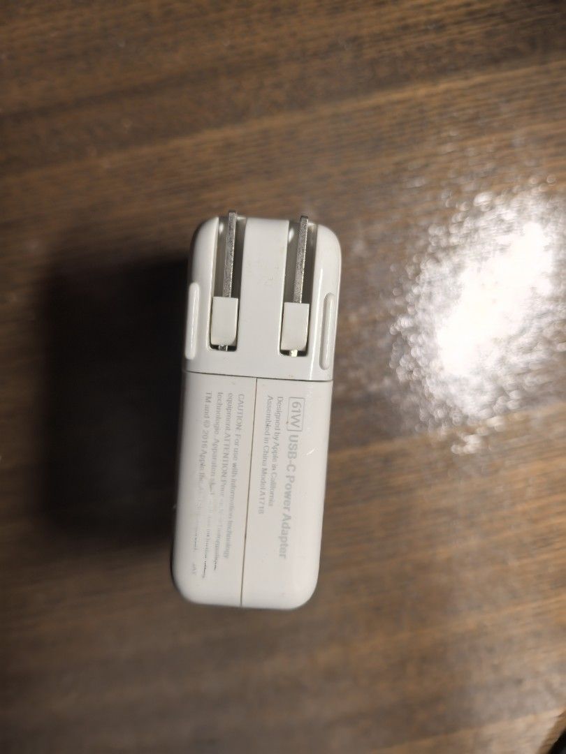 Apple 61W USB-C Power Adapter (Category: Chargers & Cables) located in Manila. Submitted by boccy2023 (Listing ID 1413819061, Image 3). Description: Fixed rate. Genuine Apple 61W USB-C Power Adapter. Features a USB-C port for charging. Authentic. Self used. No cable. .