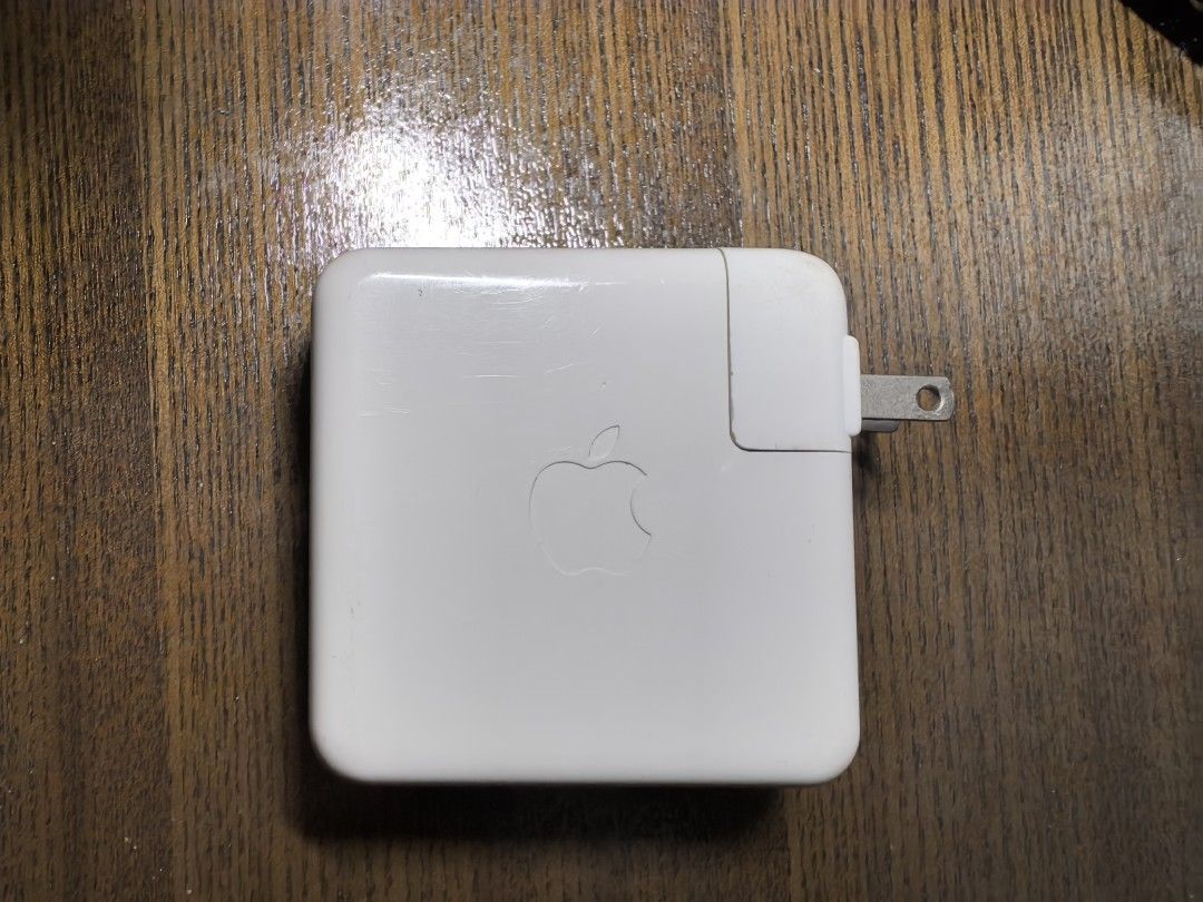 Apple 61W USB-C Power Adapter (Category: Chargers & Cables) located in Manila. Submitted by boccy2023 (Listing ID 1413819061, Image 1). Description: Fixed rate. Genuine Apple 61W USB-C Power Adapter. Features a USB-C port for charging. Authentic. Self used. No cable. .