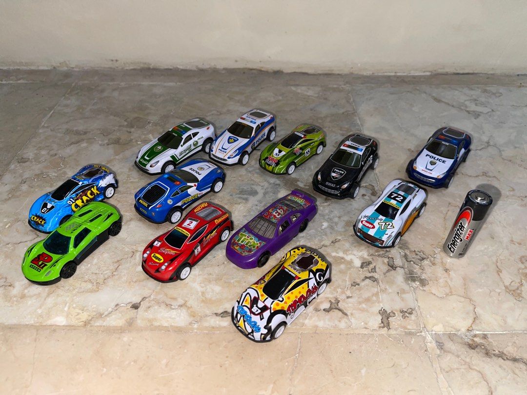 Assorted Toy Cars Collection plastic diecast (Category: Vehicle & Diecast Models) located in Pasay City. Submitted by j_wolf (Listing ID 1413759448, Image 1). Description: - Assorted toy car collection - Includes emergency vehicles, race cars, and novelty designs - Variety of colors and styles - Features a toy astronaut figure - Includes a space shuttle car - Detailed graphics on some cars - Great for collectors and kids 260 per set.