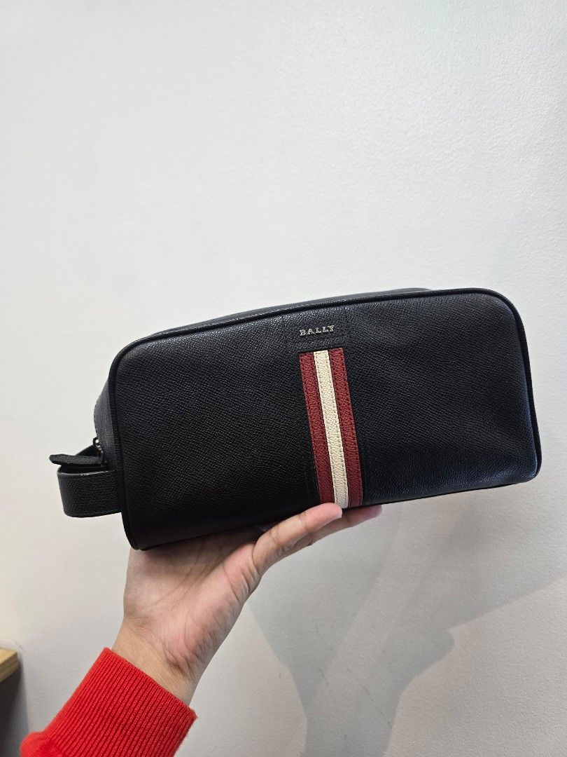 Bally Takimo Black Clutch Bag (Category: Luxury Bags & Wallets) located in Taguig. Submitted by mluxeph (Listing ID 1413670672, Image 1). Description: Bally Takimo Black Clutch Bag Gender: Unisex Material: Bovine leather Interior: Four open pockets and one main compartment Measurements: 10.1”L X 4.25”W X 5”H Handle Drop: 1.5" Hardware: Silver tone Inclusions: Care card.