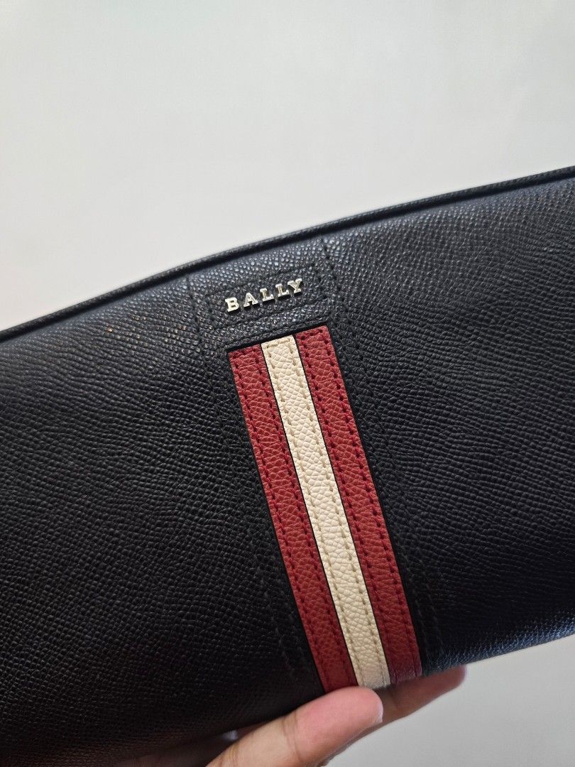 Bally Takimo Black Clutch Bag (Category: Luxury Bags & Wallets) located in Taguig. Submitted by mluxeph (Listing ID 1413670672, Image 2). Description: Bally Takimo Black Clutch Bag Gender: Unisex Material: Bovine leather Interior: Four open pockets and one main compartment Measurements: 10.1”L X 4.25”W X 5”H Handle Drop: 1.5" Hardware: Silver tone Inclusions: Care card.