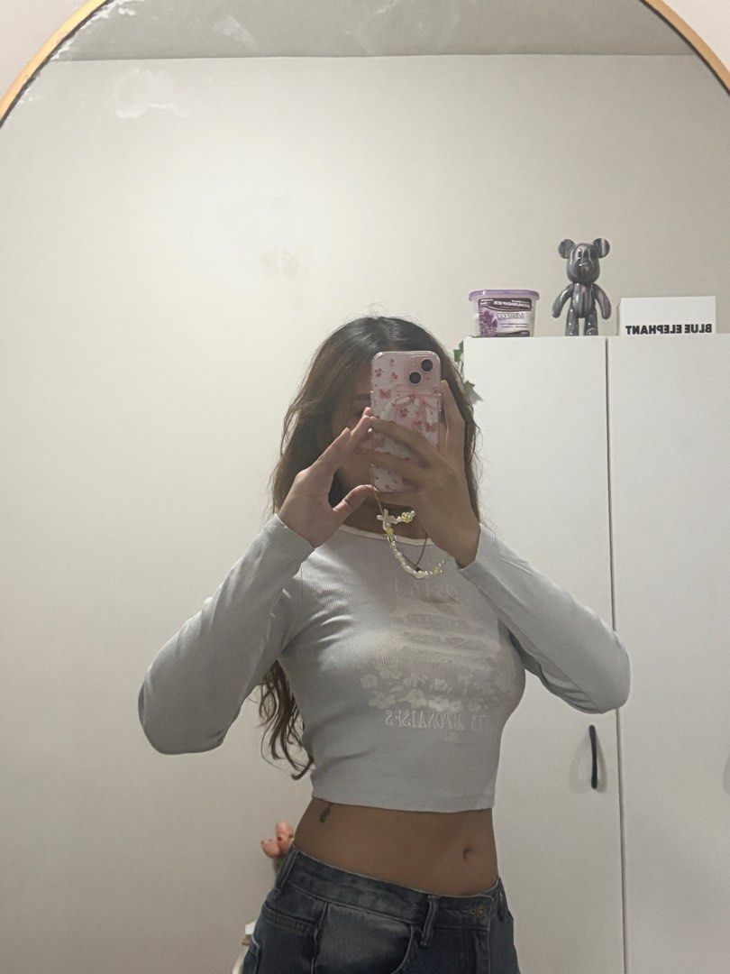 Bershka Blue Cropped Longsleeves (Category: Longsleeves) located in Muntinlupa City. Submitted by ldt30__ (Listing ID 1413745104, Image 1). Description: - s-m - bought in bershka glorietta - has minor stain in the middle printed part loc: paranaque or taft.