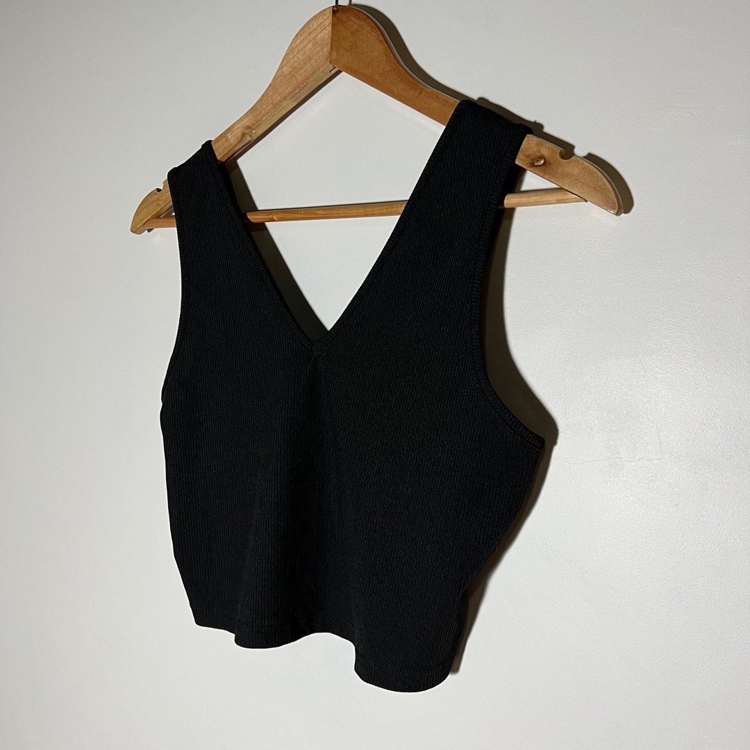 Black Ribbed V-neck Top (Category: Blouses) located in Paranaque City. Submitted by shopdeclutterfly (Listing ID 1413833165, Image 2). Description: BRAND: None BEST FITS: Medium Message me for more information. Important Notes: — Color may vary slightly due to lighting and screen settings. — This is a preloved item. — Minor signs of wear may be present — There may be small stains, dots, or marks due to storage and previous use. — Please manage ex