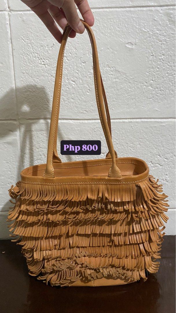 Bree Fringe Handbag (Category: Luxury Bags & Wallets) located in Manila. Submitted by peachylola (Listing ID 1413750251, Image 1). Description: - Tan handbag with fringe detailing - Zipper closure - Interior pocket - Brand: "Bree" - Two handles - Price: PHP 500.