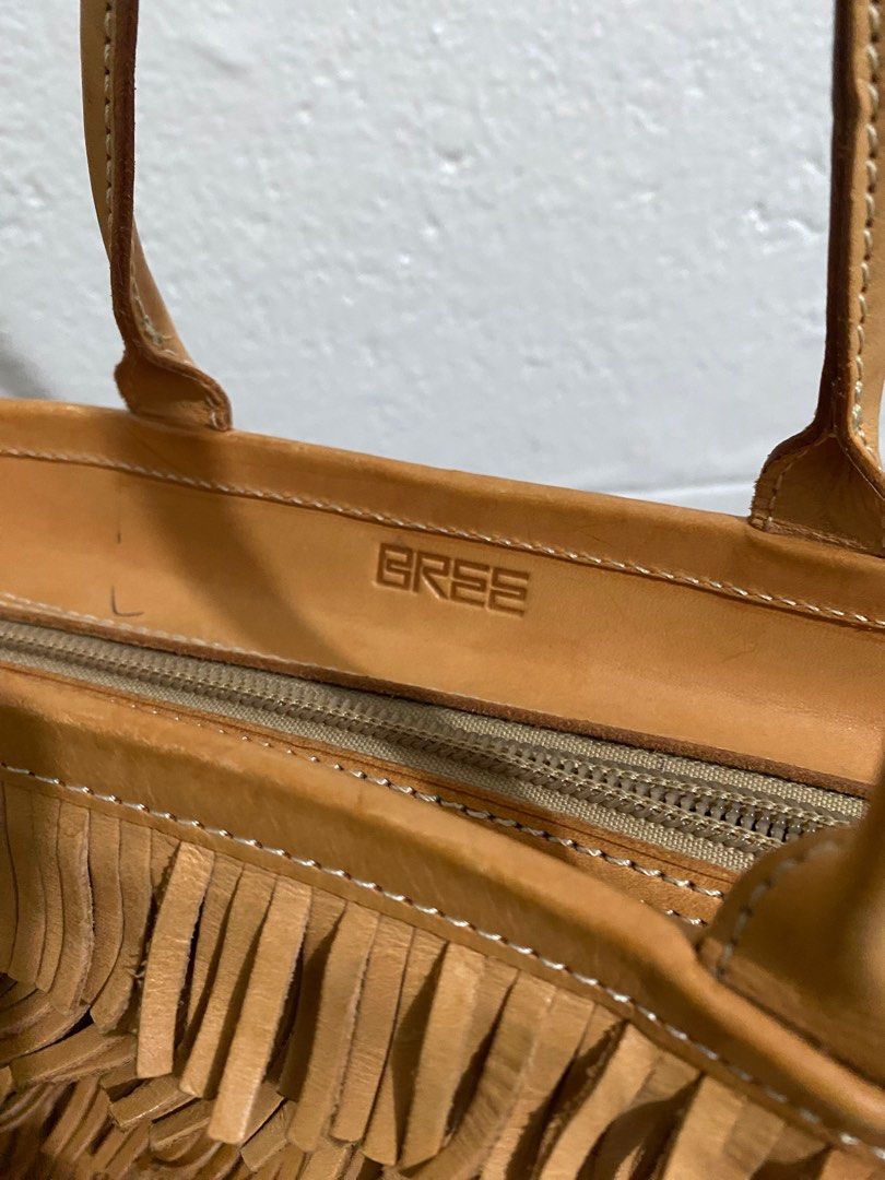 Bree Fringe Handbag (Category: Luxury Bags & Wallets) located in Manila. Submitted by peachylola (Listing ID 1413750251, Image 2). Description: - Tan handbag with fringe detailing - Zipper closure - Interior pocket - Brand: "Bree" - Two handles - Price: PHP 500.