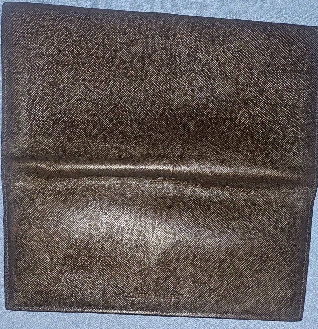 Burberry Long Wallet (Category: Luxury Bags & Wallets) located in Cainta. Submitted by PrinzAaronGiftshop (Listing ID 1413757942, Image 2). Description: Buberry leather long folded wallet From Japan With sign of usage But still in good condition - Authentic Burberry long wallet - Classic check lining - Features the Burberry logo - Multiple card slots - Compartments for bills and essentials - Dark, textured exterior - Zipper closure.