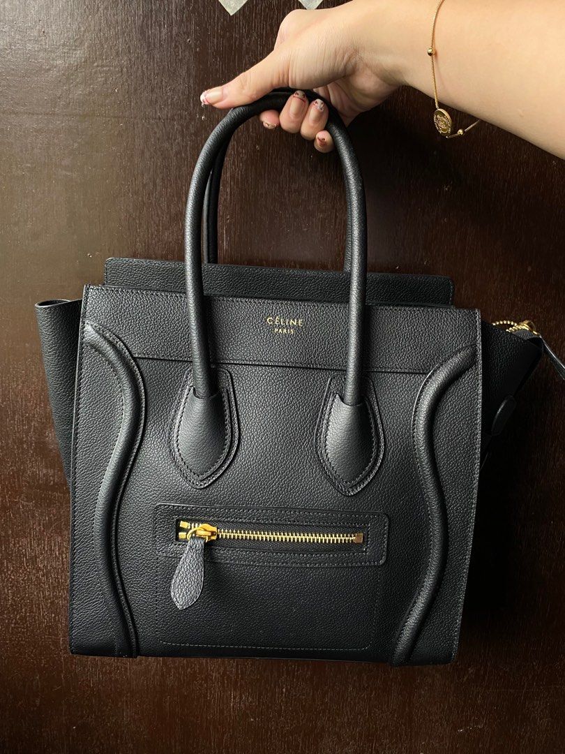 Celine Luggage Nano Handbag Black (Category: Luxury Bags & Wallets) located in Nagcarlan. Submitted by zshopperz.199x (Listing ID 1413687532, Image 1). Description: - Celine Luggage Nano handbag - Color: Black - Design: Top handle - Closure: Zip closure - Exterior: Front zip pocket - Hardware: Gold-toned - Material: Leather - Celine logo on front ALL MY ITEM MUST SALE PAMIGAY SALE ‼️ As is na po message nalang po para sa mga minimal damage natamb