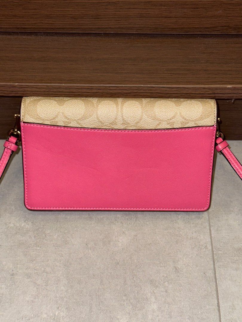 Coach Anna Crossbody Bag (Category: Luxury Bags & Wallets) located in San Fernando. Submitted by miso.ph (Listing ID 1413778918, Image 2). Description: - Coach crossbody bag - Signature Coach pattern on front - Pink back and strap - Interior with card slots and zippered compartment - Gold-tone Coach logo and hardware Issues: slight dents as seen on photo.