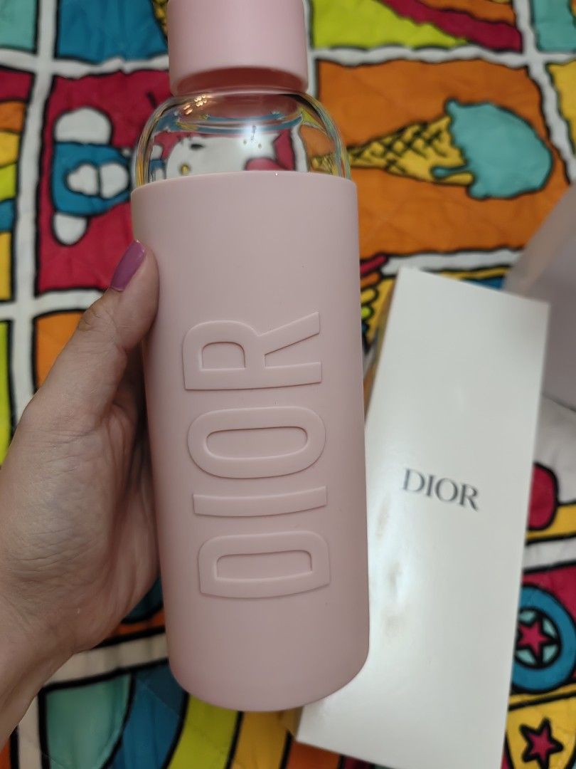Dior Pink Water Bottle (Category: Water Bottles & Tumblers) located in Mexico. Submitted by kitty_go (Listing ID 1413741601, Image 3). Description: - Authentic Dior water bottle - Pink color - Includes original box and shopping bag - Dior logo on bottle and box - Pink silicone sleeve and cap.