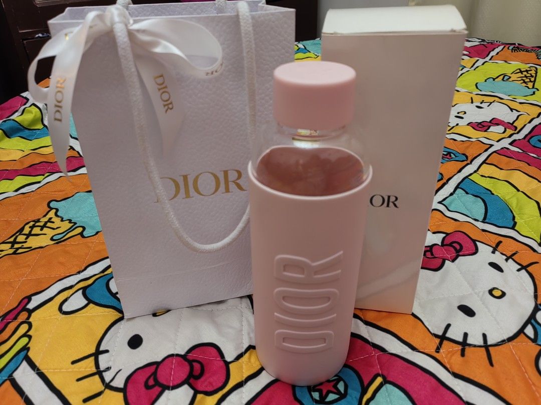 Dior Pink Water Bottle (Category: Water Bottles & Tumblers) located in Mexico. Submitted by kitty_go (Listing ID 1413741601, Image 2). Description: - Authentic Dior water bottle - Pink color - Includes original box and shopping bag - Dior logo on bottle and box - Pink silicone sleeve and cap.